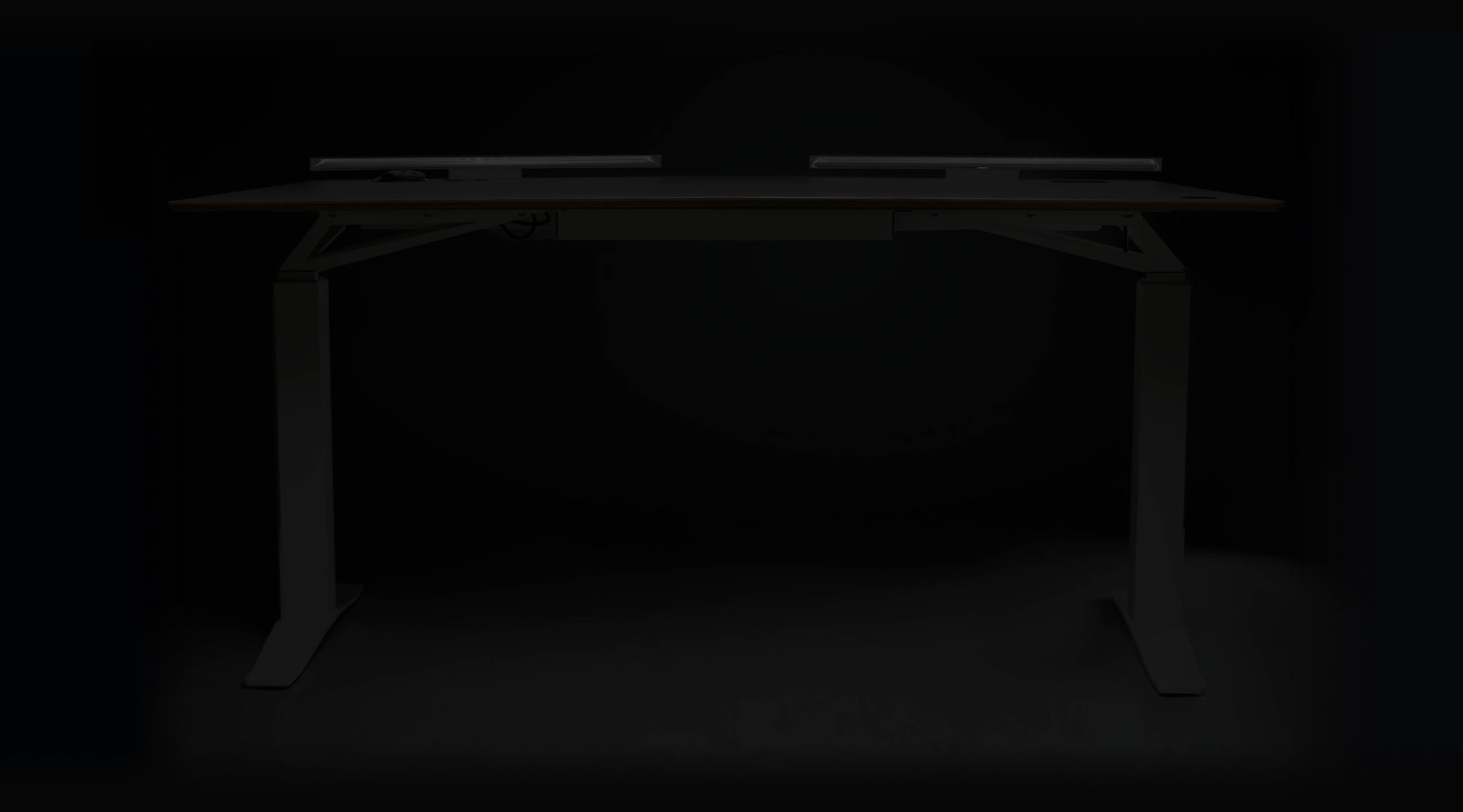 V-DESK Designer - The ultimate electric height adjustable standing desk with Lightbar, power outlets and a dedicated space for your monitor mount. Sit stand desk made in the UK.